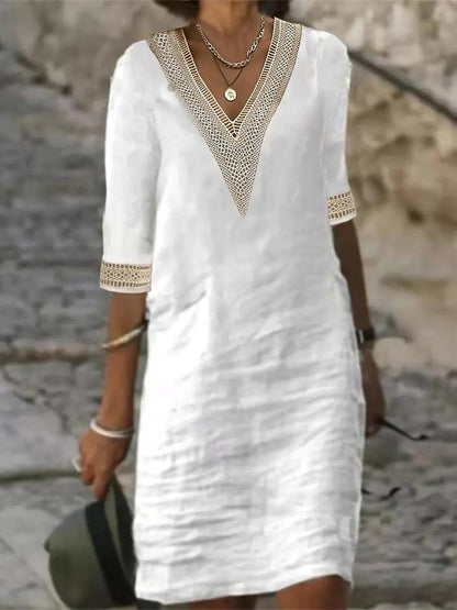 "Abito estivo in lino, scollo V con pizzo, maniche 3/4, donna. Look elegante, tessuto leggero, stile versatile."