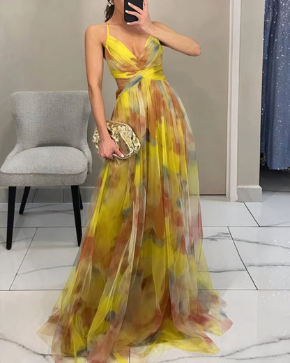 "Abito lungo donna floreale elegante, stampa delicata, silhouette fluida, ideale per eventi speciali. Vista frontale."