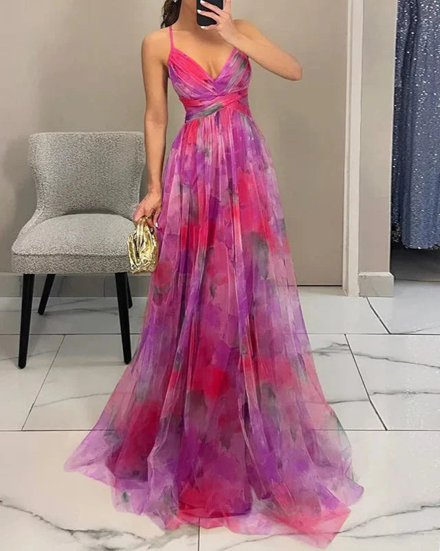 "Abito lungo donna floreale elegante, stampa delicata, silhouette fluida, ideale per eventi speciali. Vista frontale."