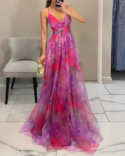 "Abito lungo donna floreale elegante, stampa delicata, silhouette fluida, ideale per eventi speciali. Vista frontale."