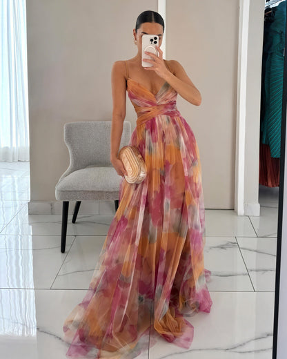 "Abito lungo donna floreale elegante, stampa delicata, silhouette fluida, ideale per eventi speciali. Vista frontale."