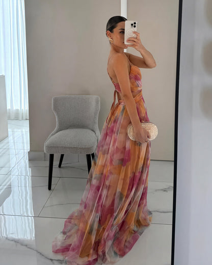 "Abito lungo donna floreale elegante, stampa delicata, silhouette fluida, ideale per eventi speciali. Vista frontale."