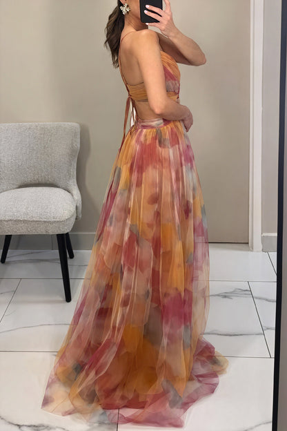 "Abito lungo donna floreale elegante, stampa delicata, silhouette fluida, ideale per eventi speciali. Vista frontale."
