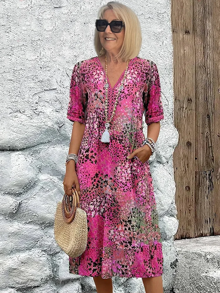 "Abito midi da donna con scollo a V, tessuto leggero e colori multipli. Elegante e versatile per ogni occasione."