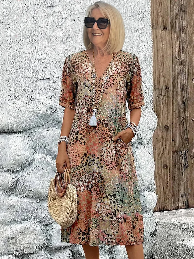 "Abito midi da donna con scollo a V, tessuto leggero e colori multipli. Elegante e versatile per ogni occasione."