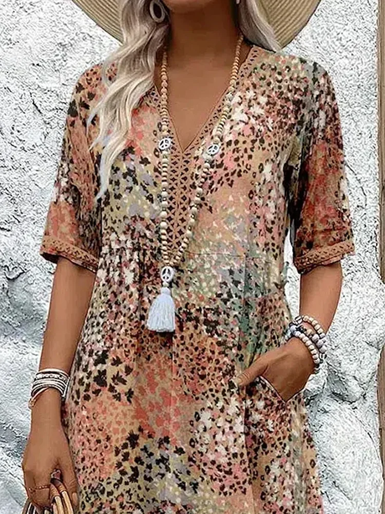 "Abito midi da donna con scollo a V, tessuto leggero e colori multipli. Elegante e versatile per ogni occasione."