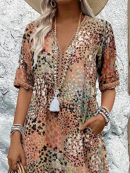 "Abito midi da donna con scollo a V, tessuto leggero e colori multipli. Elegante e versatile per ogni occasione."