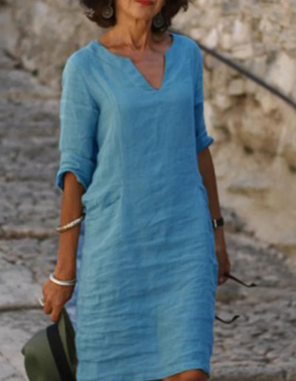 "Abito tunica donna lino con scollo a V, silhouette fluente, ideale per l'estate, colore chiaro, stile casual e raffinato"