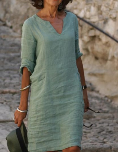 "Abito tunica donna lino con scollo a V, silhouette fluente, ideale per l'estate, colore chiaro, stile casual e raffinato"