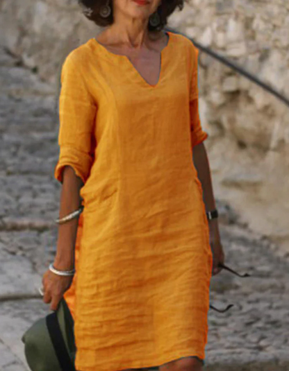 "Abito tunica donna lino con scollo a V, silhouette fluente, ideale per l'estate, colore chiaro, stile casual e raffinato"