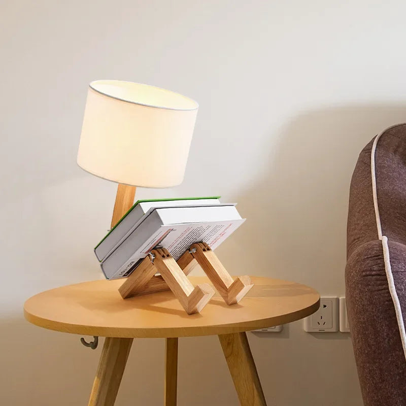 Elegant adjustable wooden robot table lamp with a natural wood finish and fabric shade.