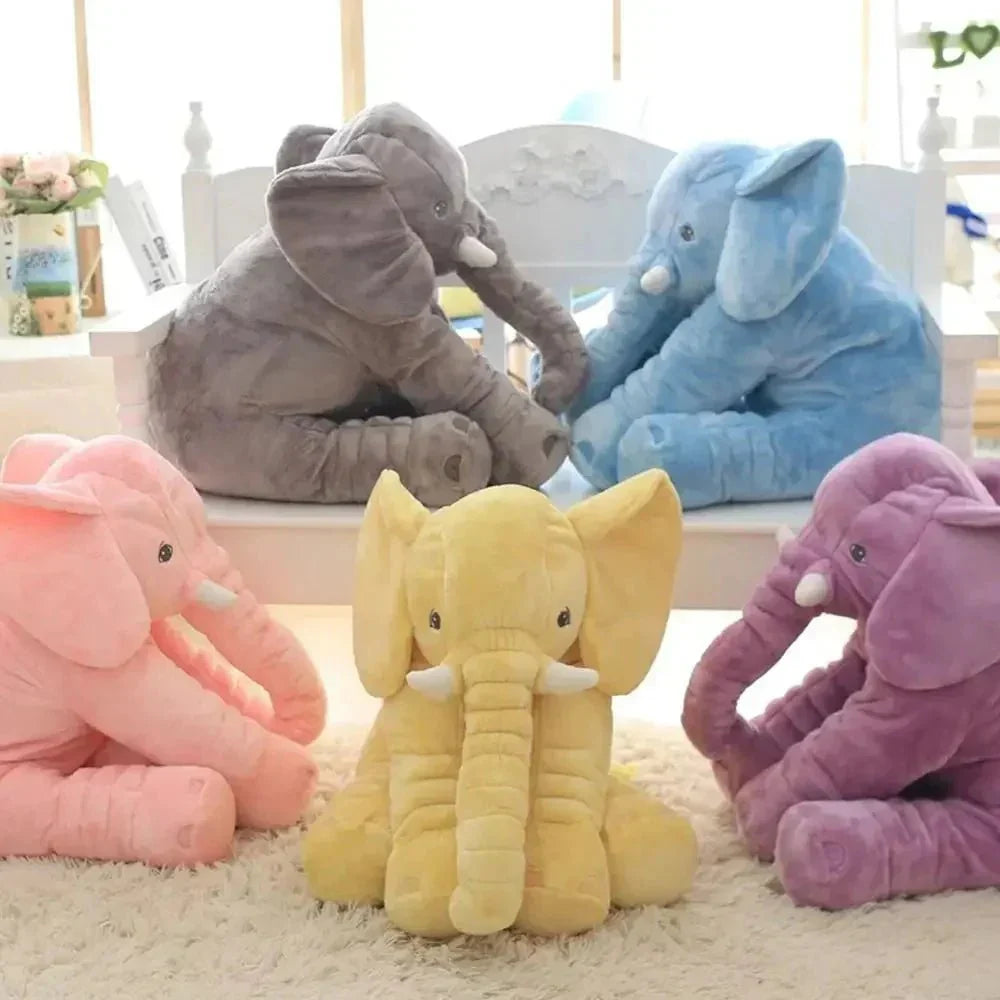 Huggable grey elephant plush pillow, a soft comfort toy for kids. Ideal baby gift and nursery decor.