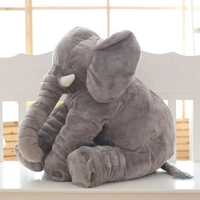 Grey elephant plush toy, a soft pillow and playful cuddle buddy for children. Great nursery item.