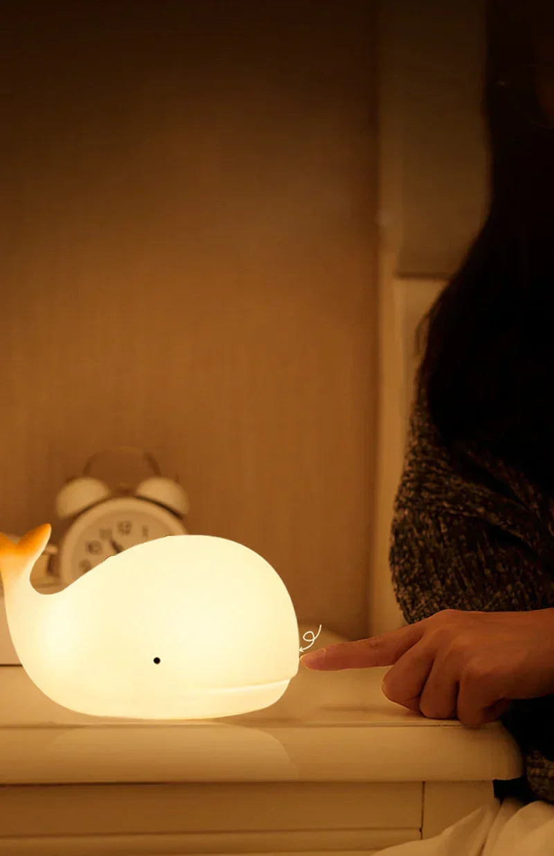Cute whale night light, ideal nursery decor & children's room gift. Features color-changing LED & soothing glow.