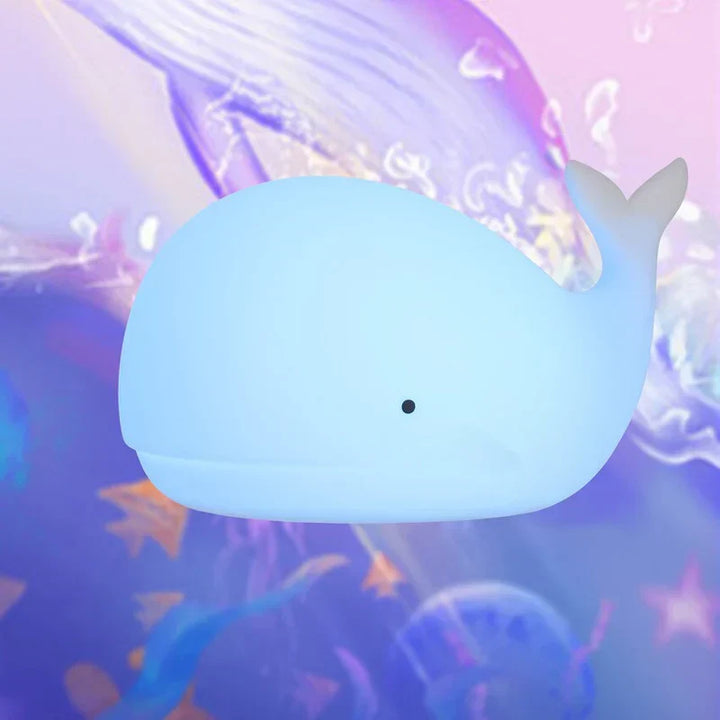 Cute blue whale night light with vibrant color-changing LED, a gentle soothing lamp for children's rooms.
