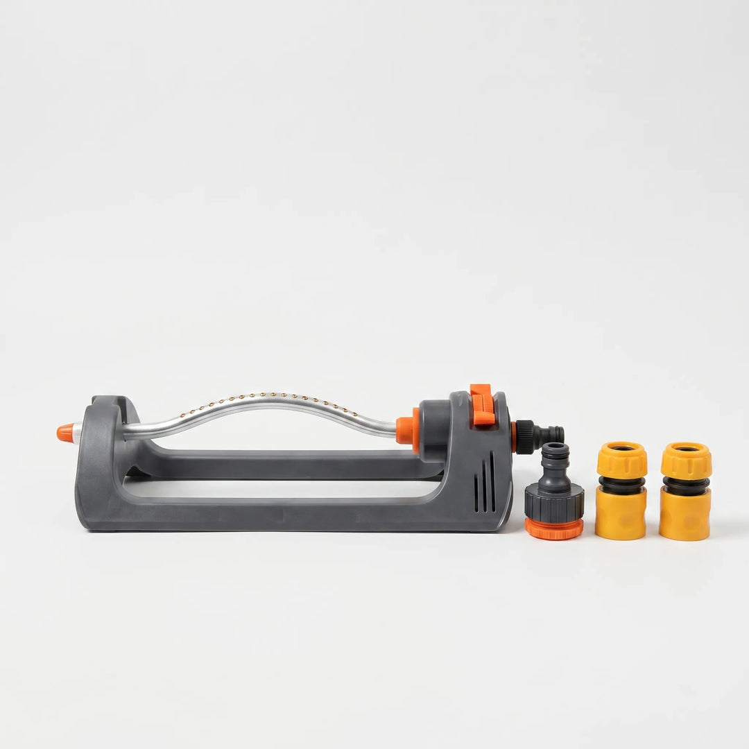 Automatic oscillating lawn sprinkler in green, ensuring even watering for lush gardens and vibrant yards.