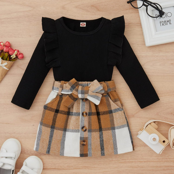 Baby girl's warm knitted turtleneck and dress, making winter super cozy.