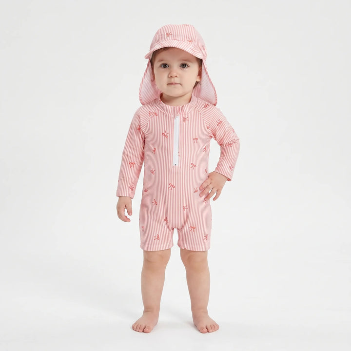 Cute baby girls' striped rash guard swimsuit with sun hat, perfect for summer fun and beach playtime.
