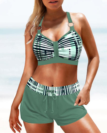 "Bikini donna a vita alta con motivo a strisce, silhouette elegante e copertura confortevole, ideale per spiaggia o piscina."