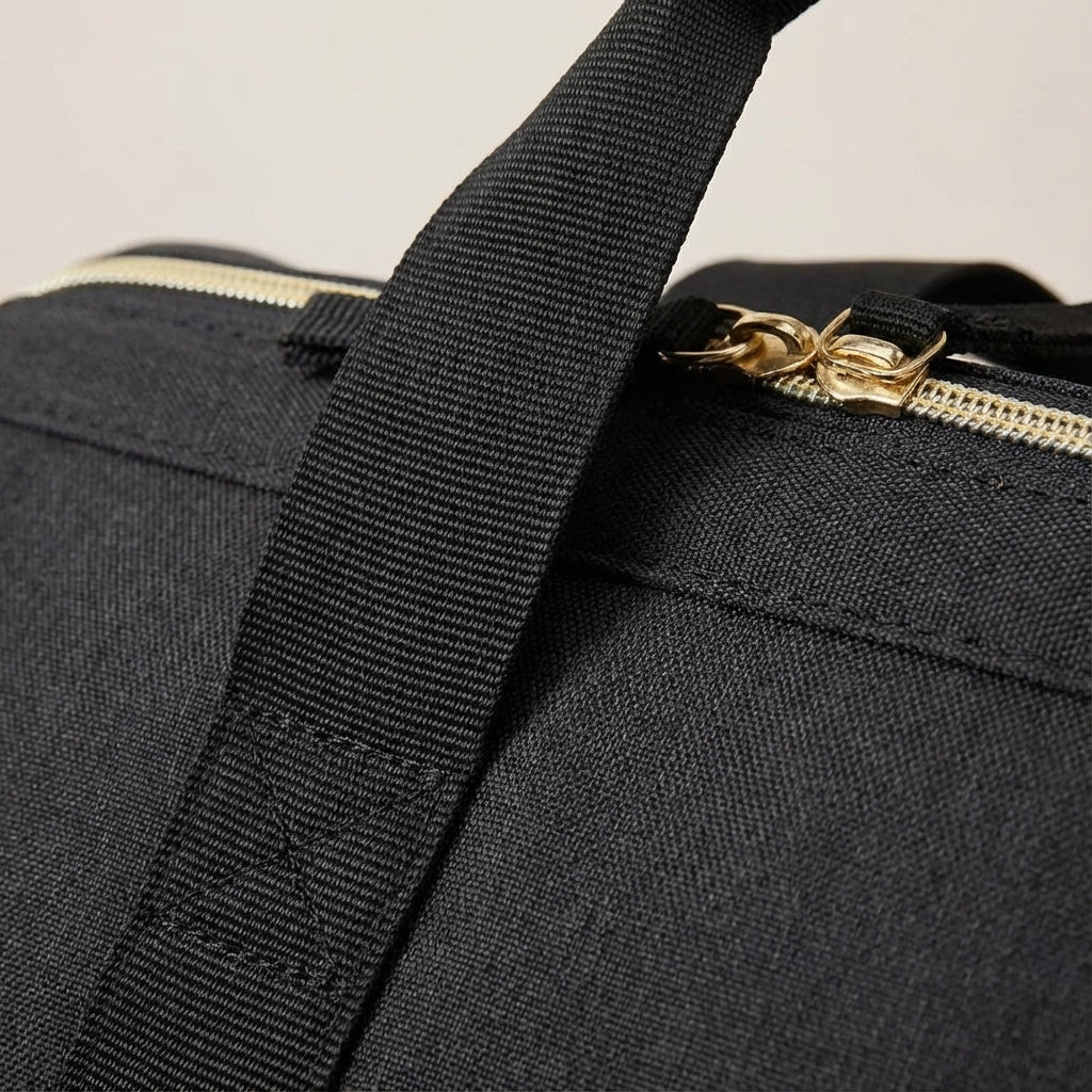 Durable black oxford fabric 33-liter waterproof travel duffel bag, excellent as a weekender or carry-on luggage.