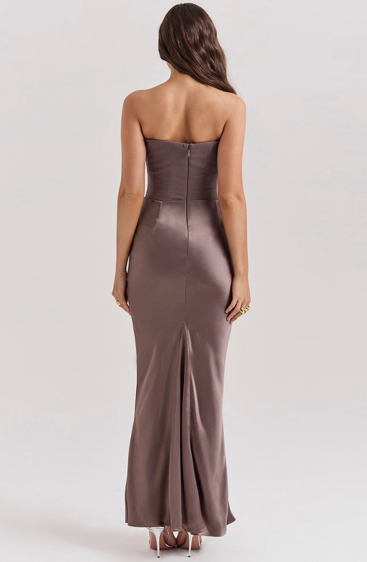 Long brown wedding guest dress, a formal strapless maxi design.