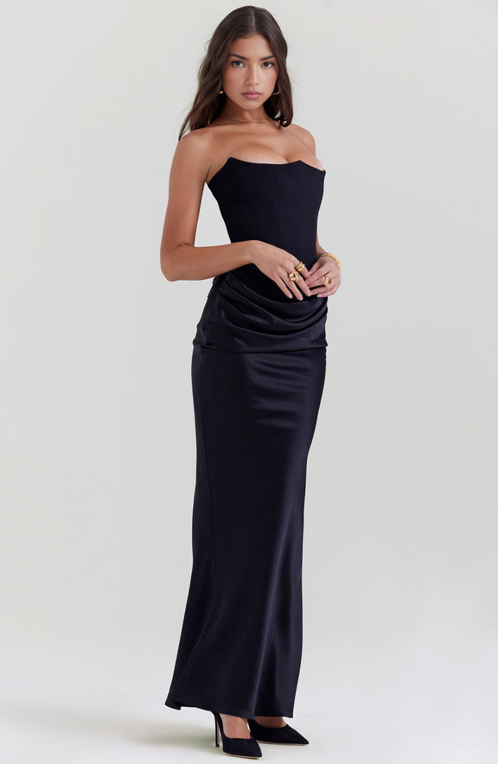 Long white wedding guest dress, a formal strapless maxi design.