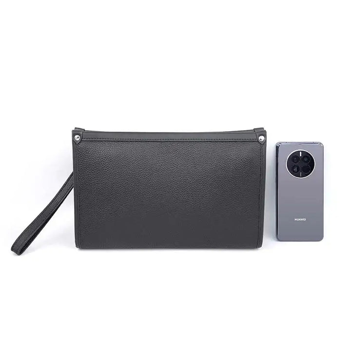 Interior view of a spacious men's black leather business clutch, ideal for documents, phone, and essentials.