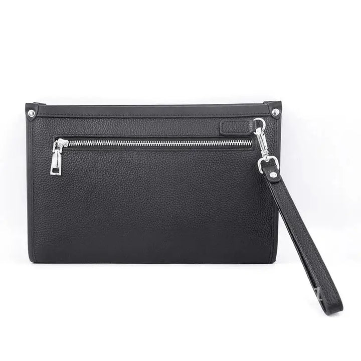 Professional man holding a black genuine leather business clutch with fingerprint lock, showcasing sleek design.