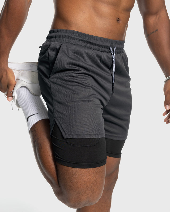 Grey men's performance training shorts with liner, durable and quick-drying.