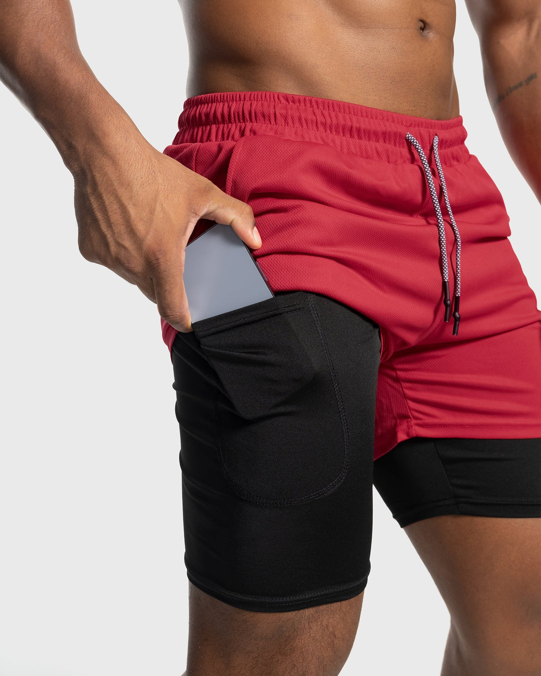 Charcoal men's gym shorts with built-in liner, quick-dry performance activewear.