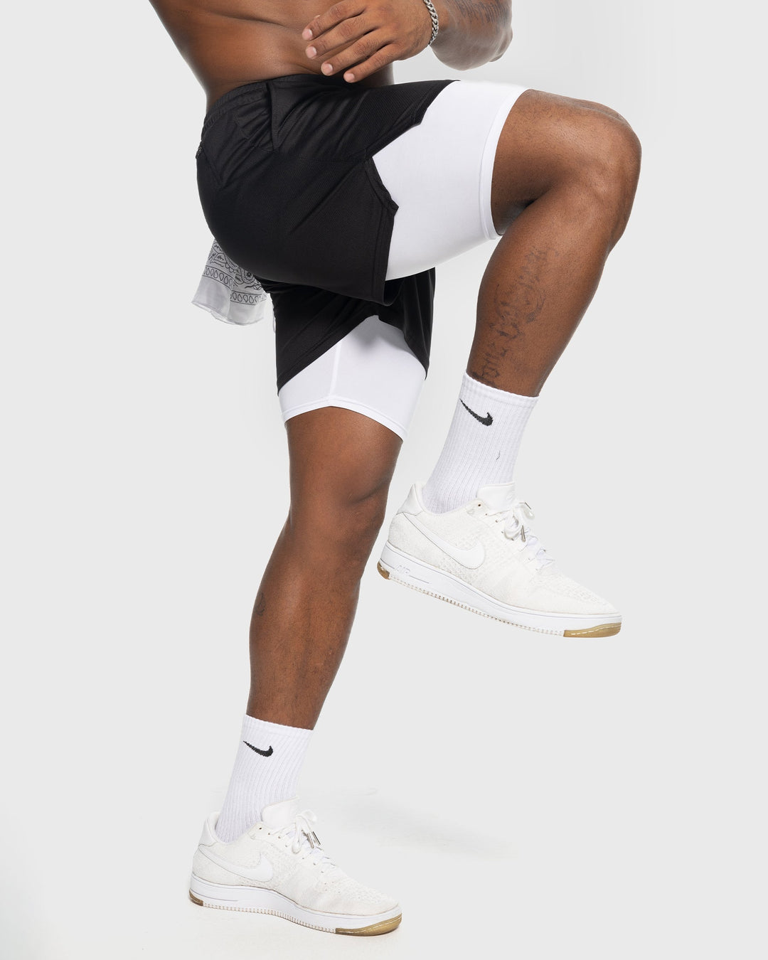 Black men's breathable gym shorts with liner, performance mesh material.
