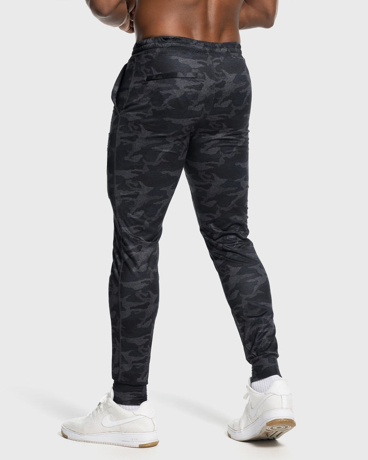 Casual men's stretch bottoms, olive, dressed up with a jacket for a stylish look.