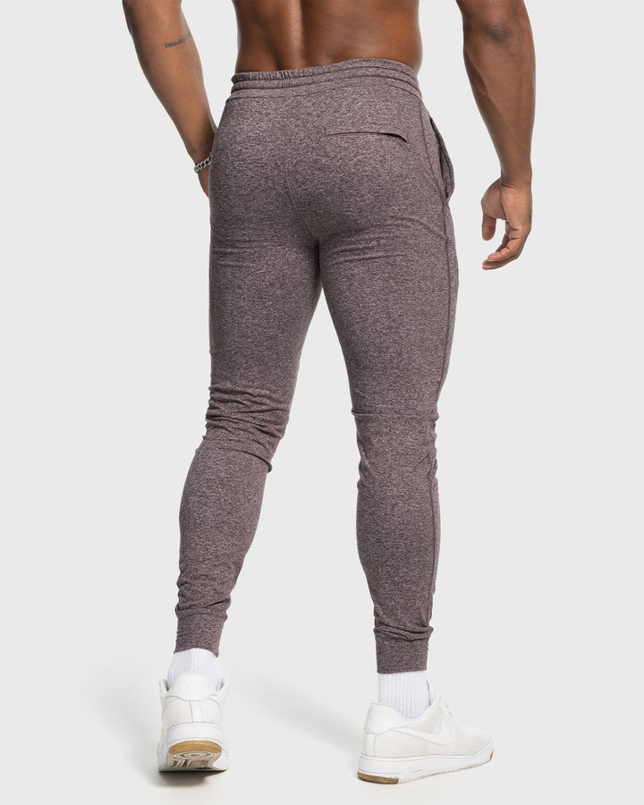Grey men's performance stretch joggers, showcasing a secure drawstring waist.