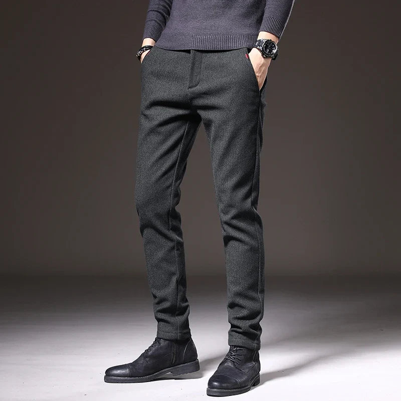 Gray tailored slim fit stretch pants, wrinkle resistant, ideal for office.