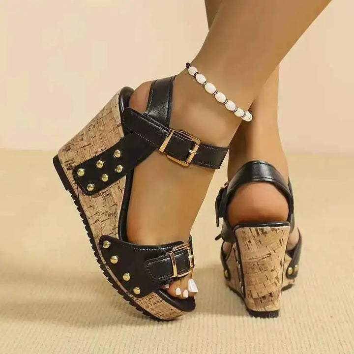 Side view of black women's comfortable buckle wedges showing orthopedic support.