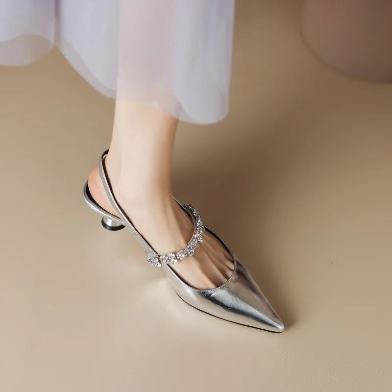 Elegant silver crystal strap pointed toe slingback heels. Ideal women's dress shoes for weddings and events.