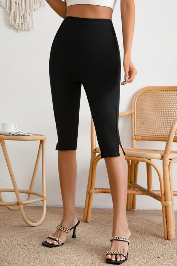 Black women's slim-fit stretch cropped pants. Comfortable capri bottoms for versatile summer style.