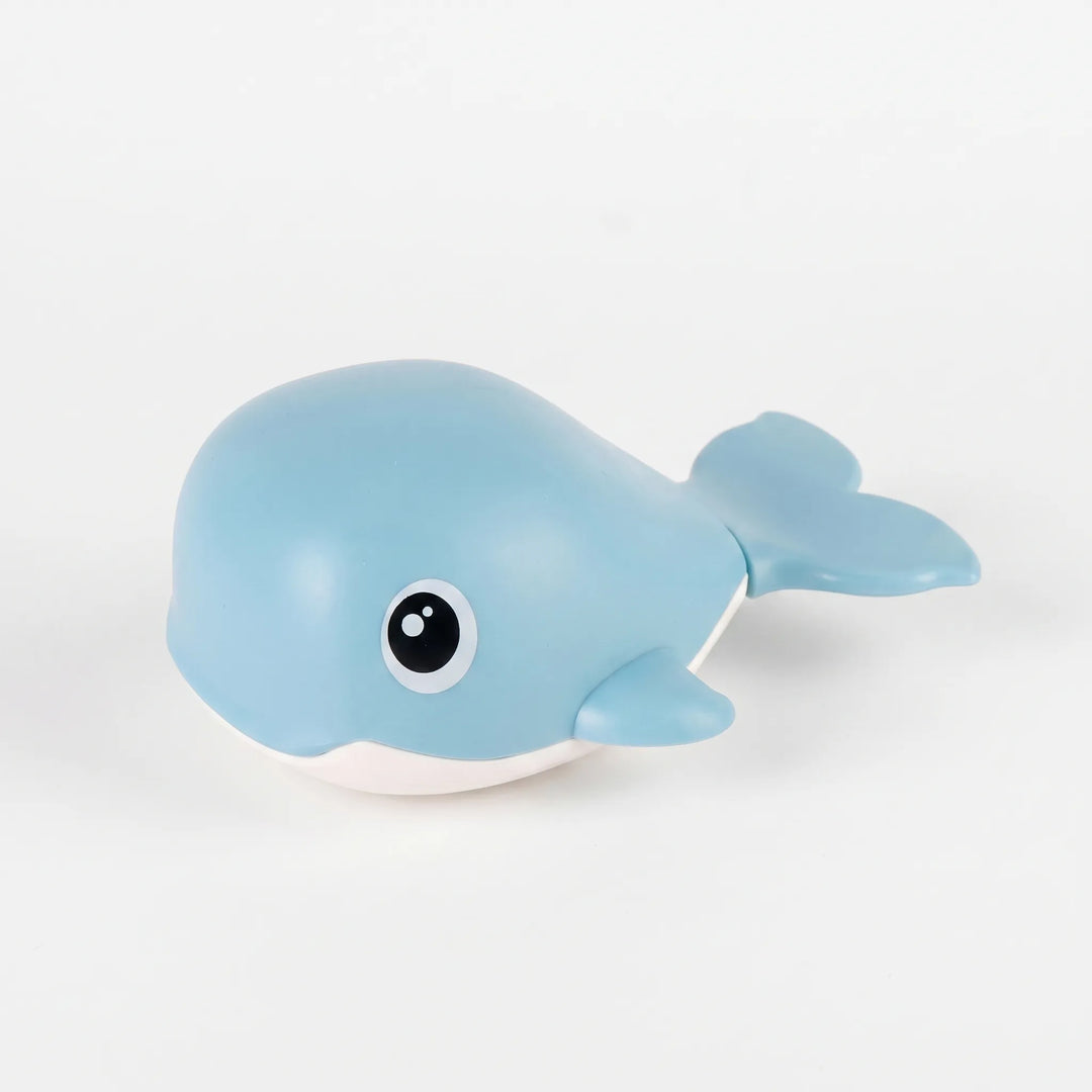 Close-up of a blue battery-free floating whale bath toy, perfect for engaging kids' water playtime.