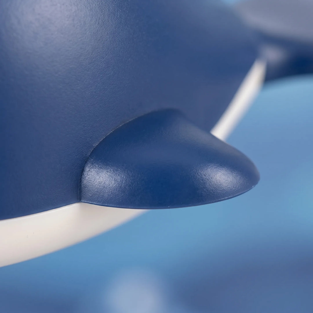 Set of colorful battery-free wind-up floating whale bath toys, fun water playtime for kids & toddlers.
