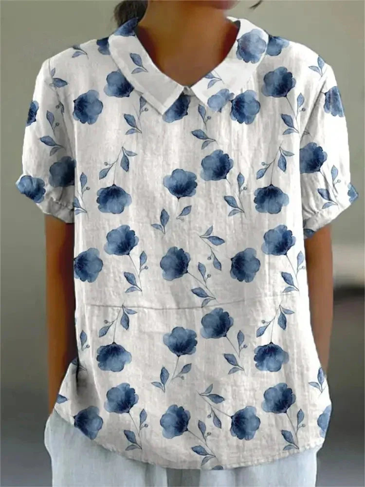 "Blusa floreale elegante in cotone e lino, colori vivaci, design versatile, vestibilità comoda per donna"