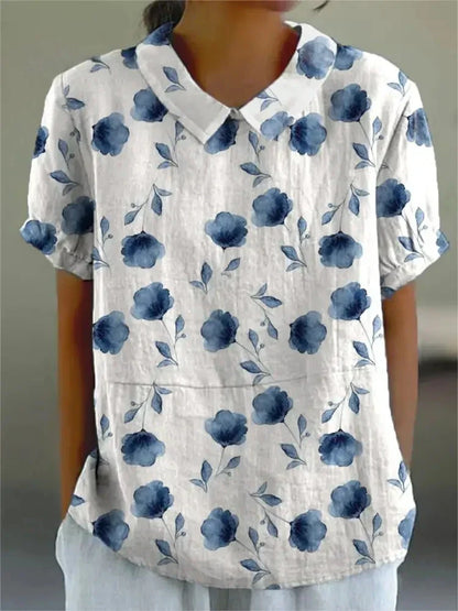 "Blusa floreale elegante in cotone e lino, colori vivaci, design versatile, vestibilità comoda per donna"