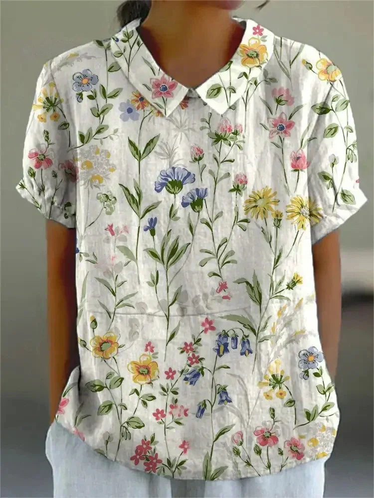 "Blusa floreale elegante in cotone e lino, colori vivaci, design versatile, vestibilità comoda per donna"