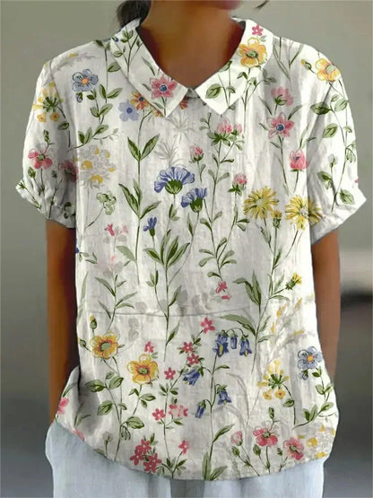 "Blusa floreale elegante in cotone e lino, colori vivaci, design versatile, vestibilità comoda per donna"