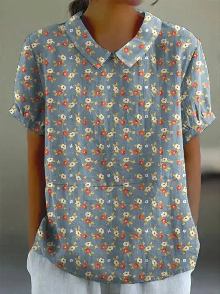 "Blusa floreale elegante in cotone e lino, colori vivaci, design versatile, vestibilità comoda per donna"