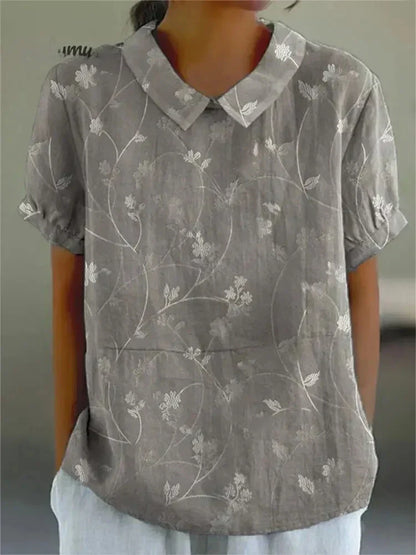 "Blusa floreale elegante in cotone e lino, colori vivaci, design versatile, vestibilità comoda per donna"