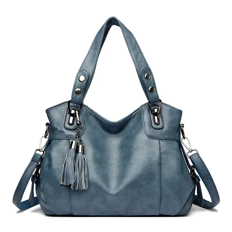 "Borsa a spalla elegante in pelle genuina; design robusto con chiusura zip e rivetti per stile e praticità."