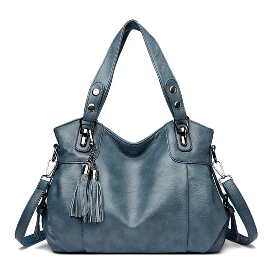 "Borsa a spalla elegante in pelle genuina; design robusto con chiusura zip e rivetti per stile e praticità."