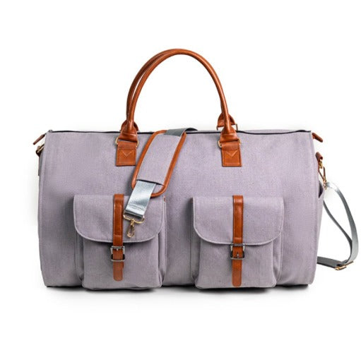 "Borsa da viaggio unisex in pelle o tela impermeabile, elegante e multifunzionale, con scomparti e tasca laterale."