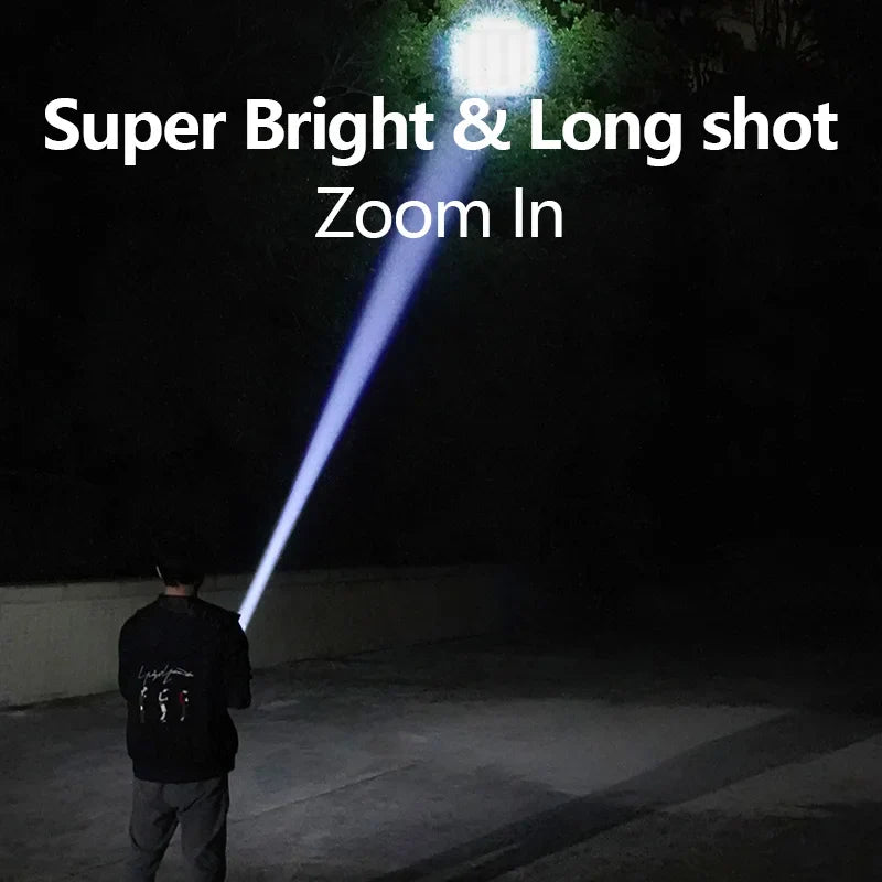 Close-up of a blue LED mini flashlight with hook, showing USB-C port, for outdoor activities