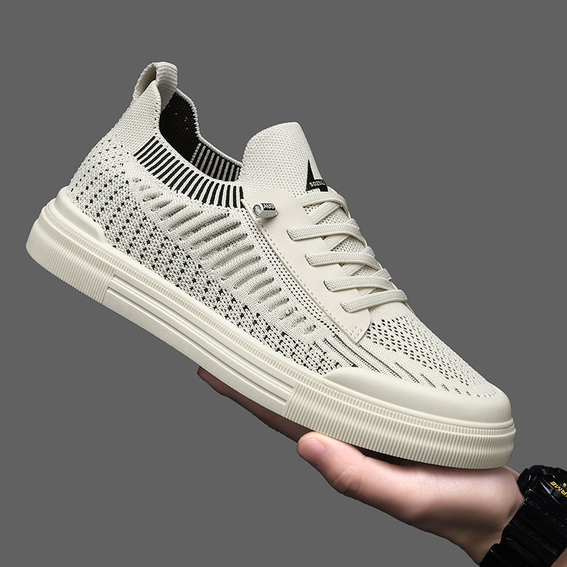 Close-up of a sand men's comfort sneaker, highlighting lightweight design & lace-up details.